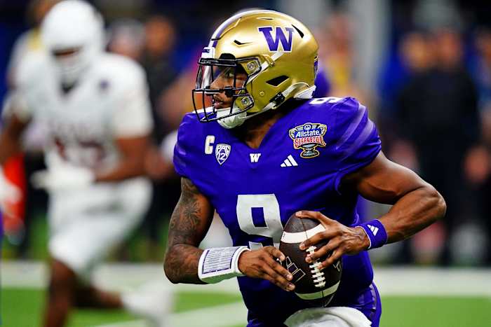 Washington Huskies quarterback Michael Penix Jr. (9) runs the ball during the fourth quarter against the Texas Longhorns in the 2024 Sugar Bowl college football playoff semifinal game at Caesars Superdome.